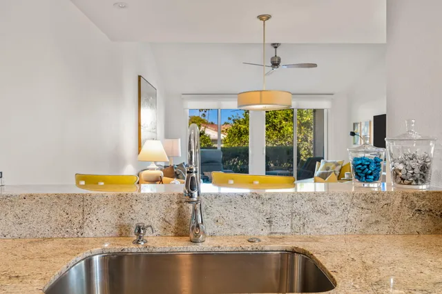 a kitchen with a sink and a window