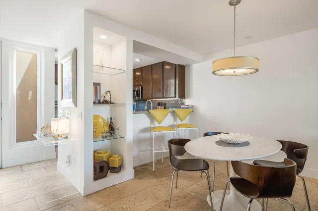 a dining room with furniture and window