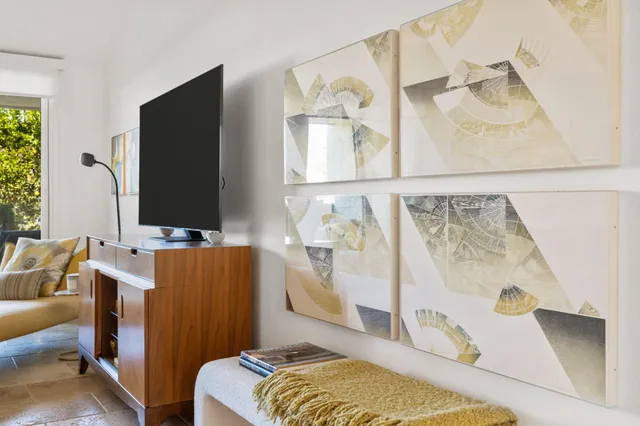 a bedroom with a bed and flat screen tv