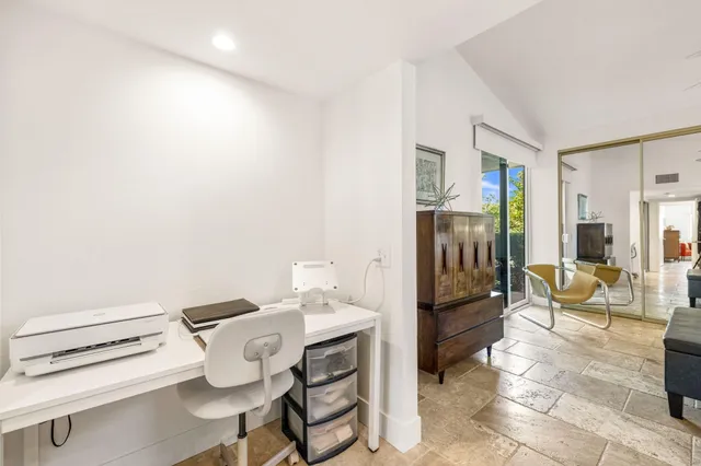 a en suite bathroom with a double vanity sink and a mirror