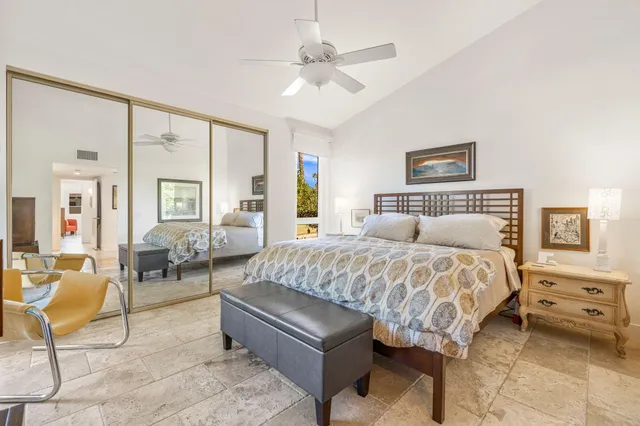 a bedroom with a bed and a couch