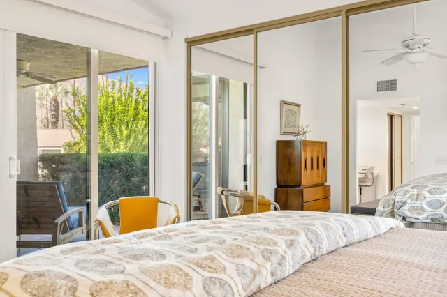 a view of a hallway with wooden floor and entryway