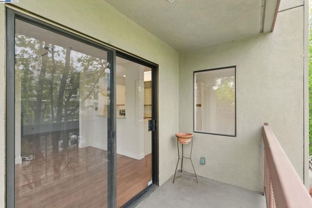 a view of a kitchen from the hallway