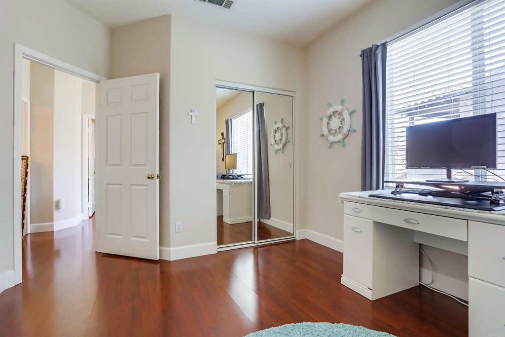 6094 Citracado Circle Carlsbad, CA 92009 - Photo 13 of 28 a view of cabinets with wooden floor and windows
