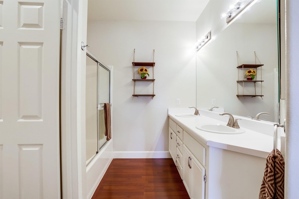 6094 Citracado Circle Carlsbad, CA 92009 - Photo 16 of 28 a bathroom with double vanity and mirrors