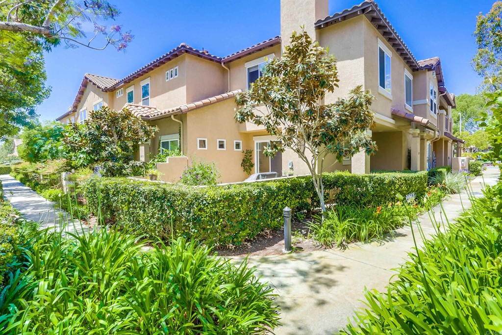 6094 Citracado Circle Carlsbad, CA 92009 - Photo 2 of 28 front view of a house with a yard