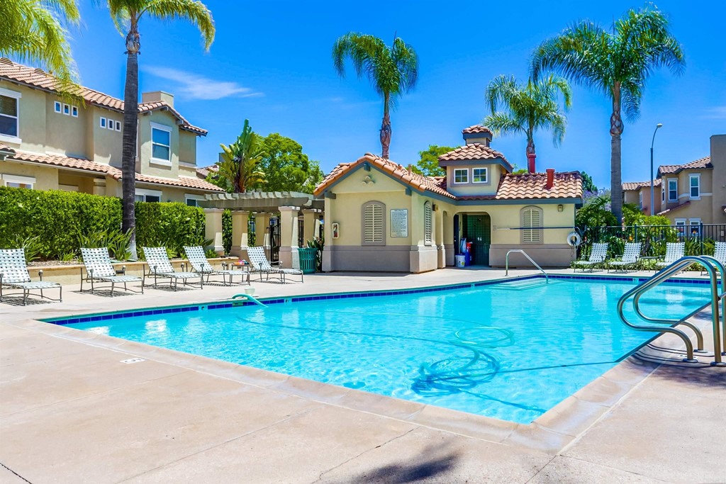 6094 Citracado Circle Carlsbad, CA 92009 - Photo 23 of 28 a front view of a house with swimming pool having outdoor seating