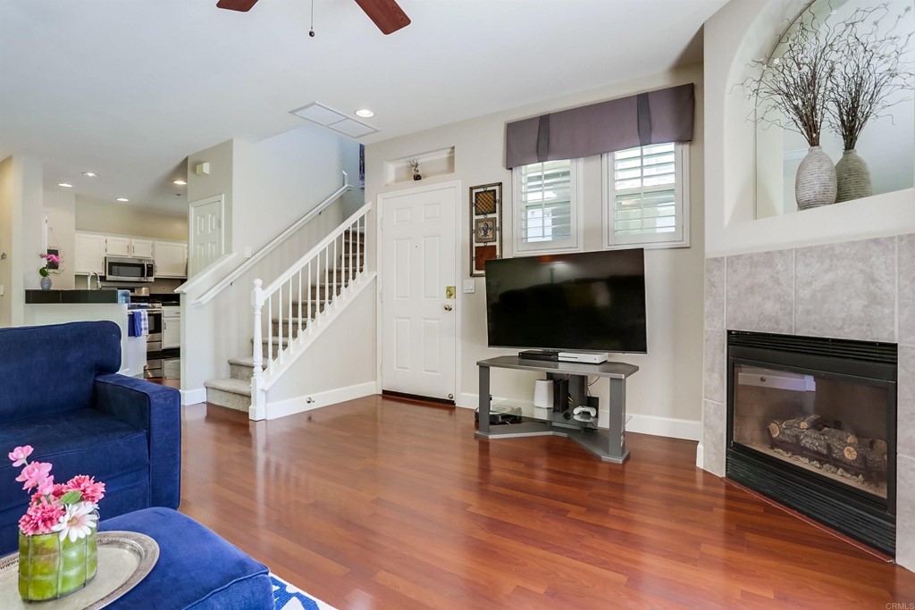 6094 Citracado Circle Carlsbad, CA 92009 - Photo 4 of 28 a living room with furniture fireplace and flat screen tv
