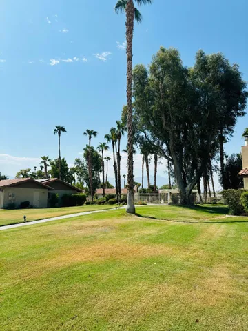 a view of a swimming pool with an outdoor space and seating area