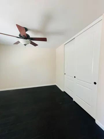 an empty room with wooden floor