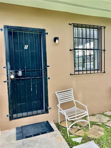 a view of wooden door and wooden floor