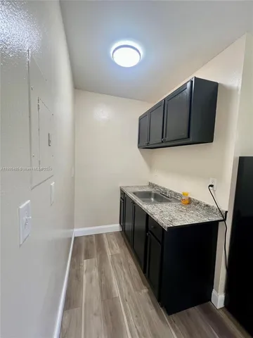 a kitchen with a stove and a microwave