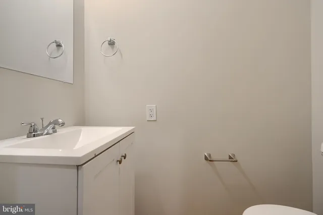 a bathroom with a sink and mirror