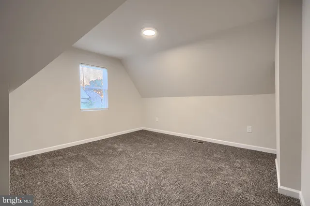 an empty room with a empty space and window