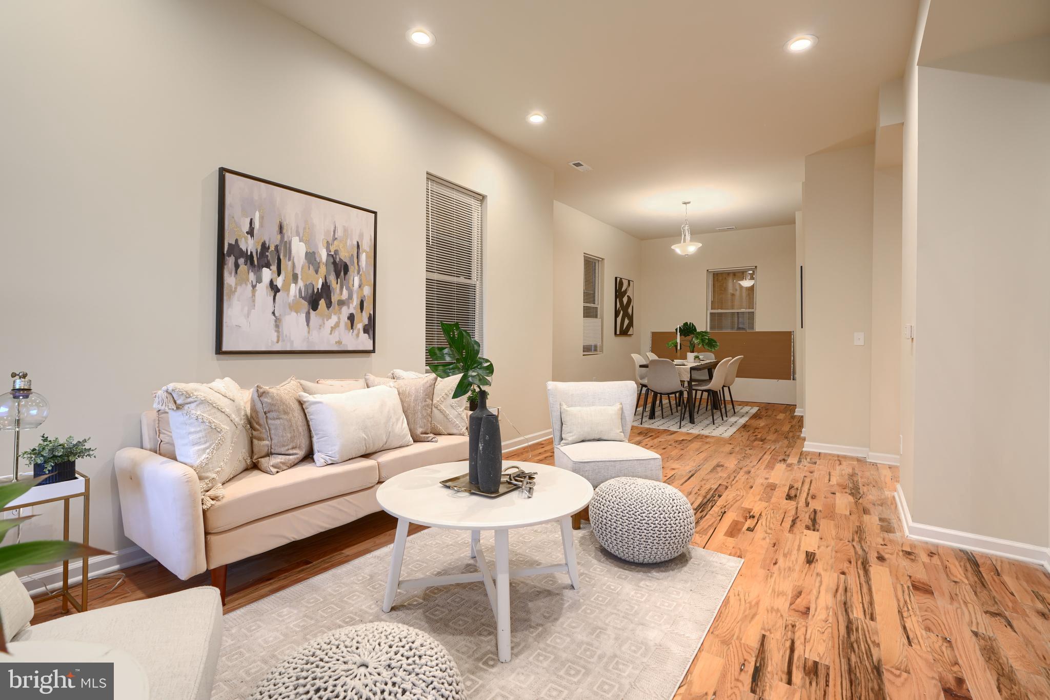 3308 Walbrook Avenue Baltimore, MD 21216 - Photo 3 of 32 a living room with furniture and a table