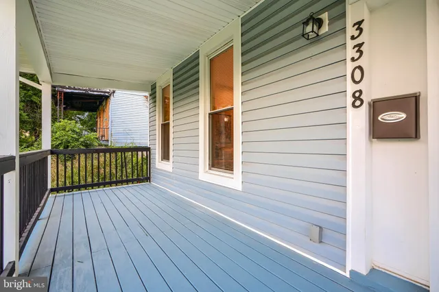 a view of a house with wooden deck