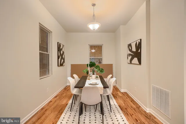 a dining room with furniture and window