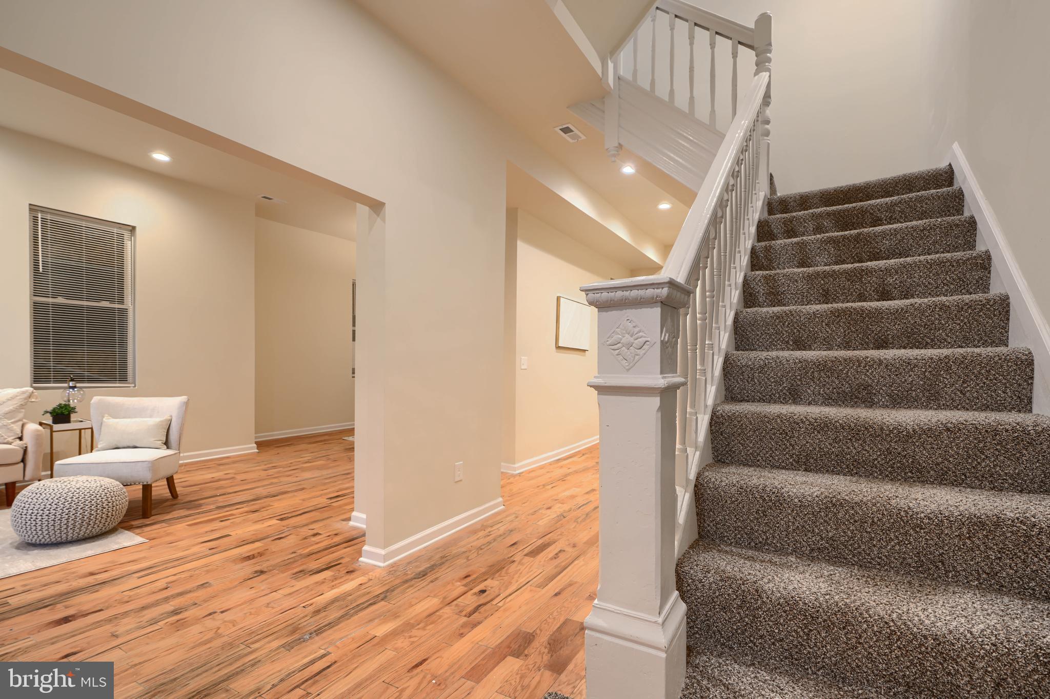 3308 Walbrook Avenue Baltimore, MD 21216 - Photo 6 of 32 a view of entryway and hall with wooden floor