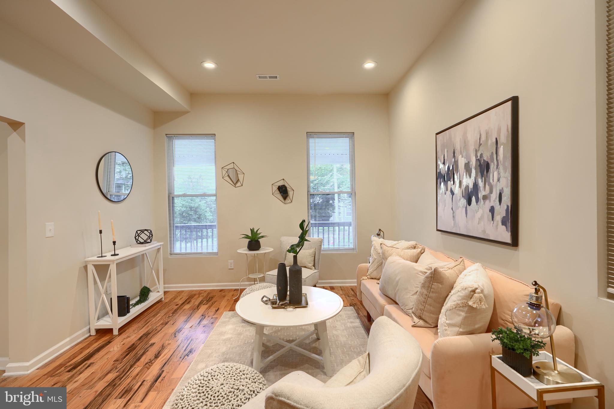 3308 Walbrook Avenue Baltimore, MD 21216 - Photo 10 of 32 a living room with furniture and a wooden floor