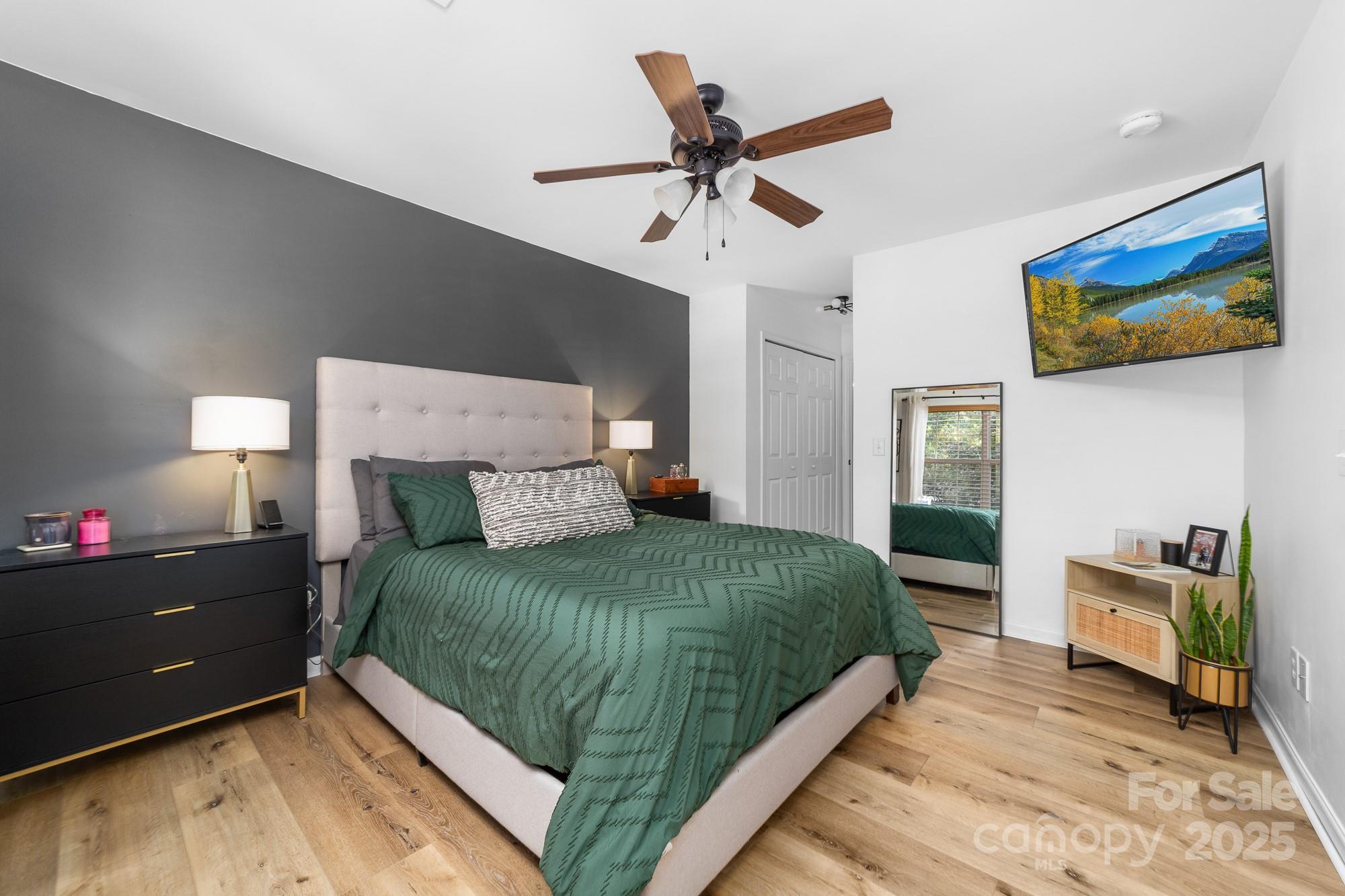 1542 Maypine Commons Way Rock Hill, SC 29732 - Photo 13 of 36 a bedroom with a bed and a chandelier