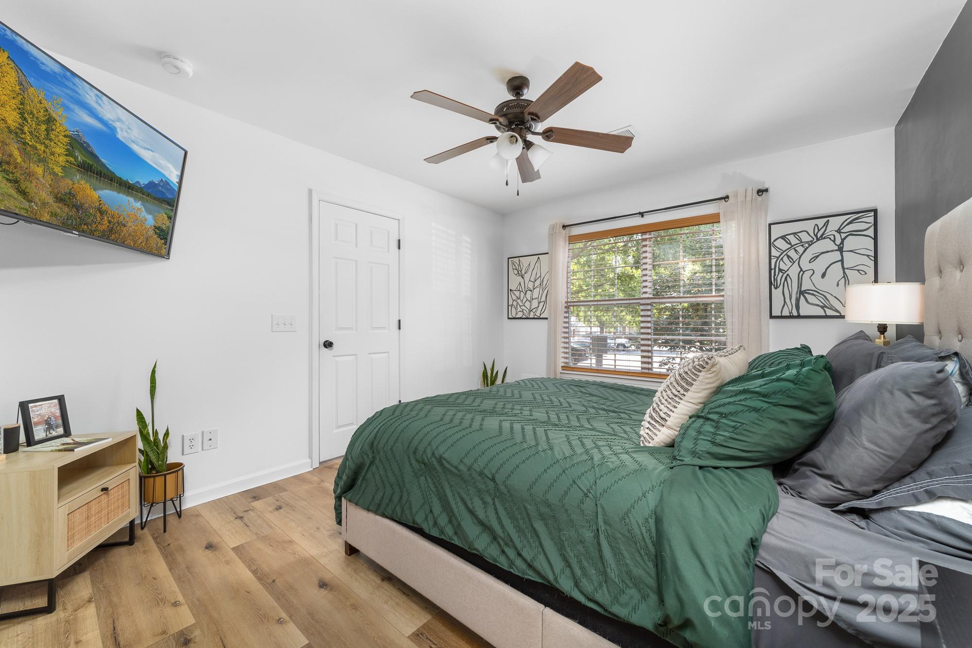 1542 Maypine Commons Way Rock Hill, SC 29732 - Photo 14 of 36 a living room with a bed furniture and a window