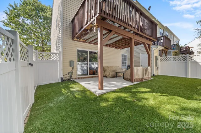 a view of a house with backyard and porch