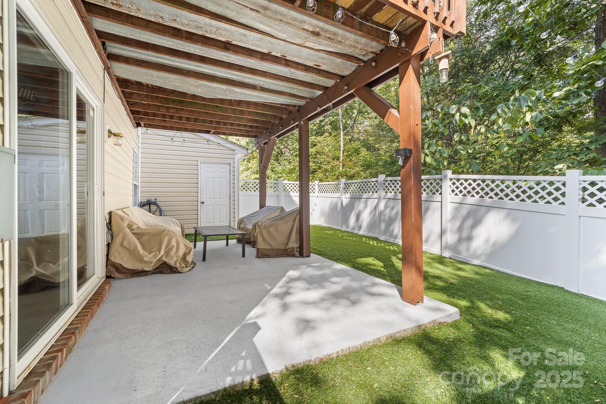 1542 Maypine Commons Way Rock Hill, SC 29732 - Photo 20 of 36 a backyard of a house with seating space