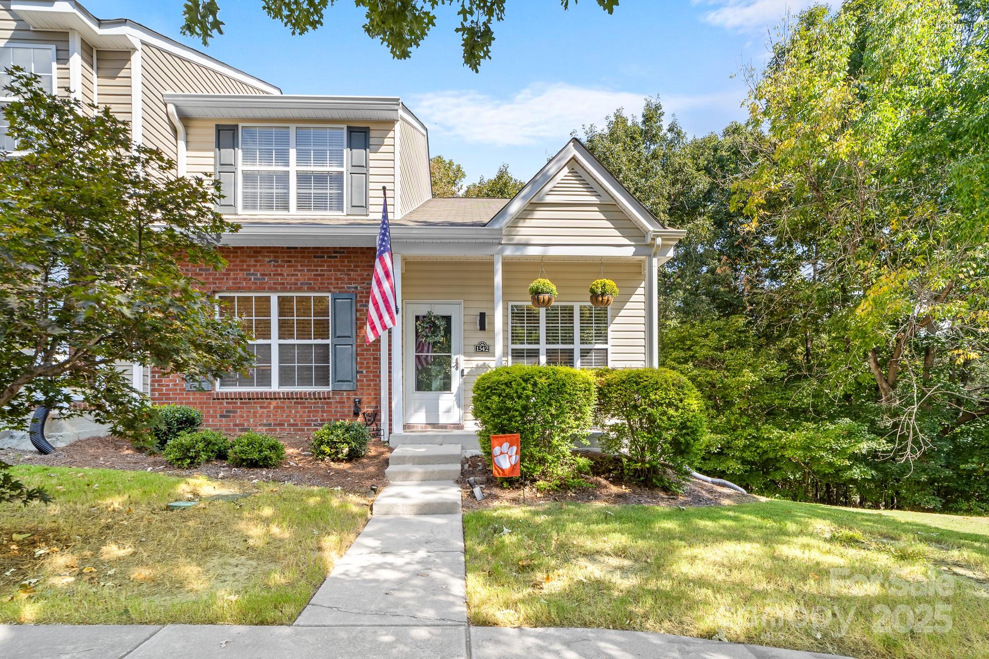 1542 Maypine Commons Way Rock Hill, SC 29732 - Photo 2 of 36 a view of a house with small yard plants and large tree