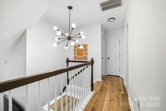 a view of a hallway with a chandelier