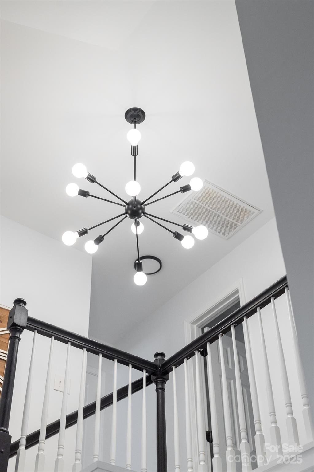 1542 Maypine Commons Way Rock Hill, SC 29732 - Photo 26 of 36 a view of staircase with railing and pendant lights