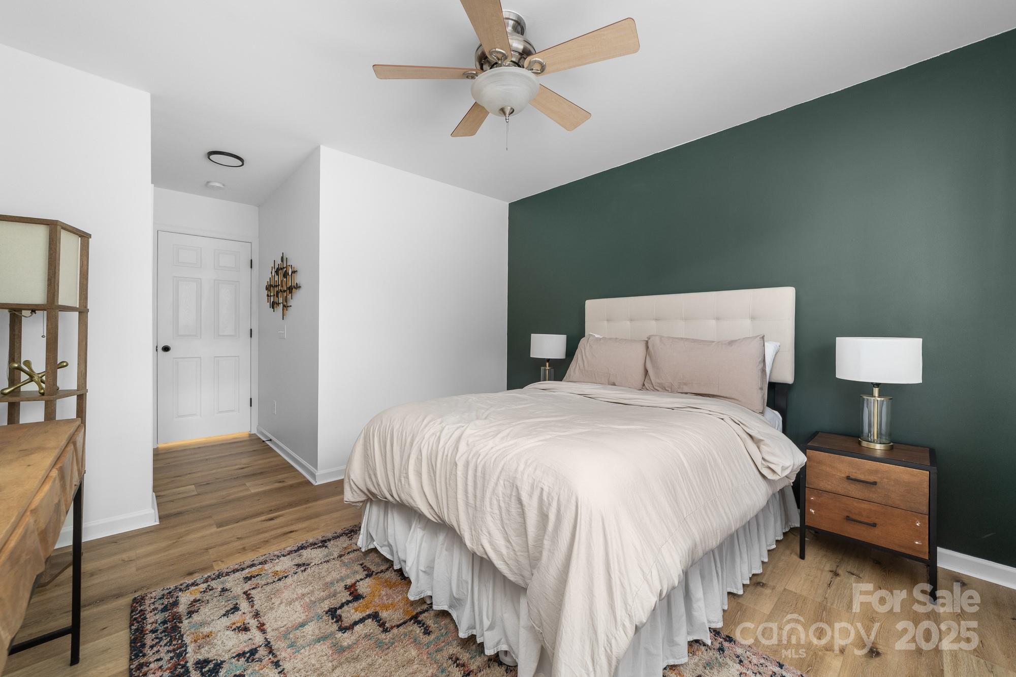 1542 Maypine Commons Way Rock Hill, SC 29732 - Photo 28 of 36 a bedroom with a bed and a lamp