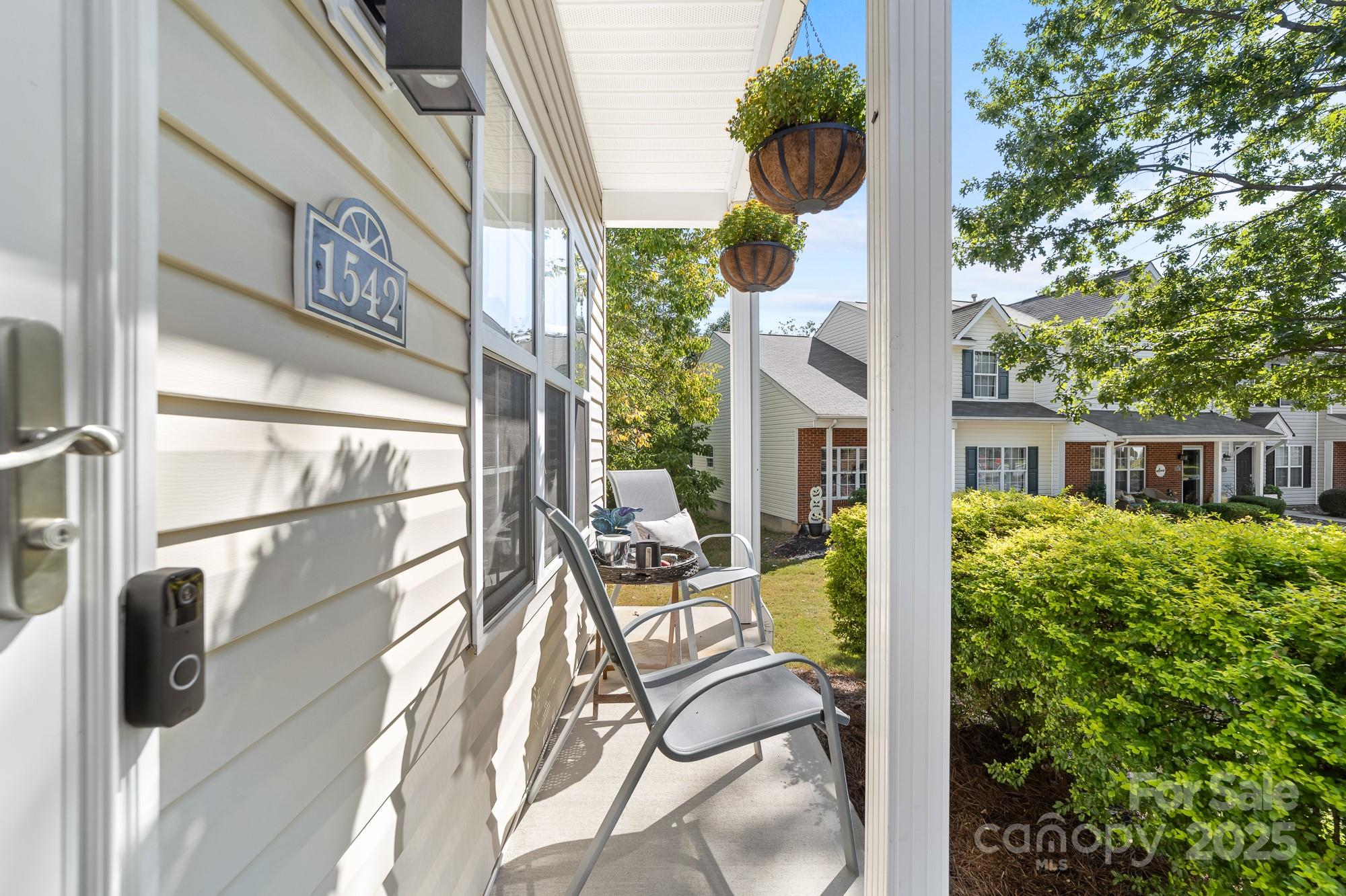 1542 Maypine Commons Way Rock Hill, SC 29732 - Photo 3 of 36 a view of a balcony with chairs and iron fence