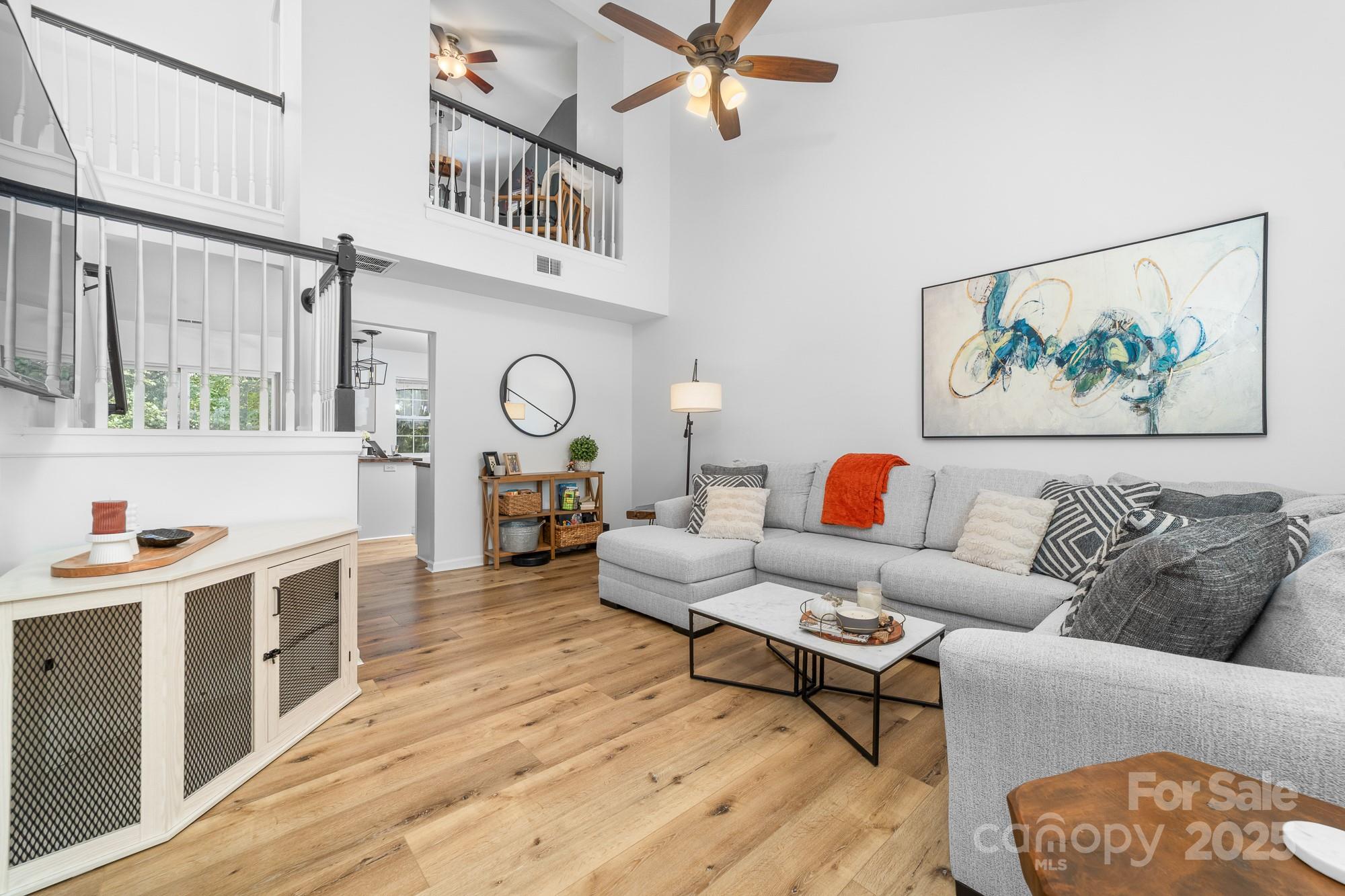 1542 Maypine Commons Way Rock Hill, SC 29732 - Photo 4 of 36 a living room with furniture and a clock