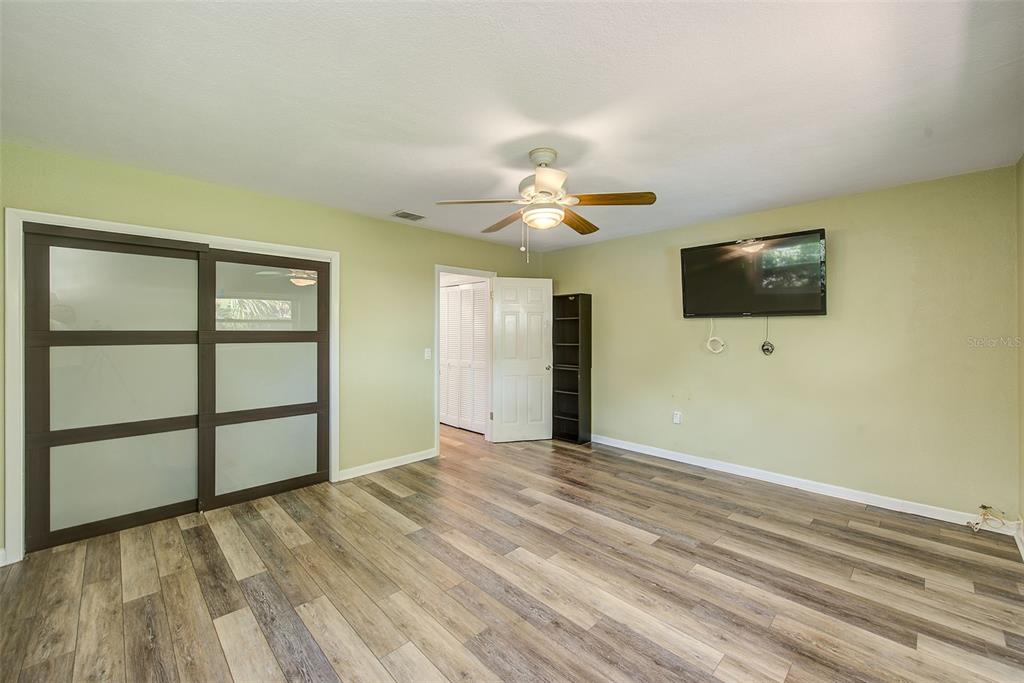 14079 Victoria Road Largo, FL 33774 - Photo 22 of 46 a view of a livingroom with a flat screen tv