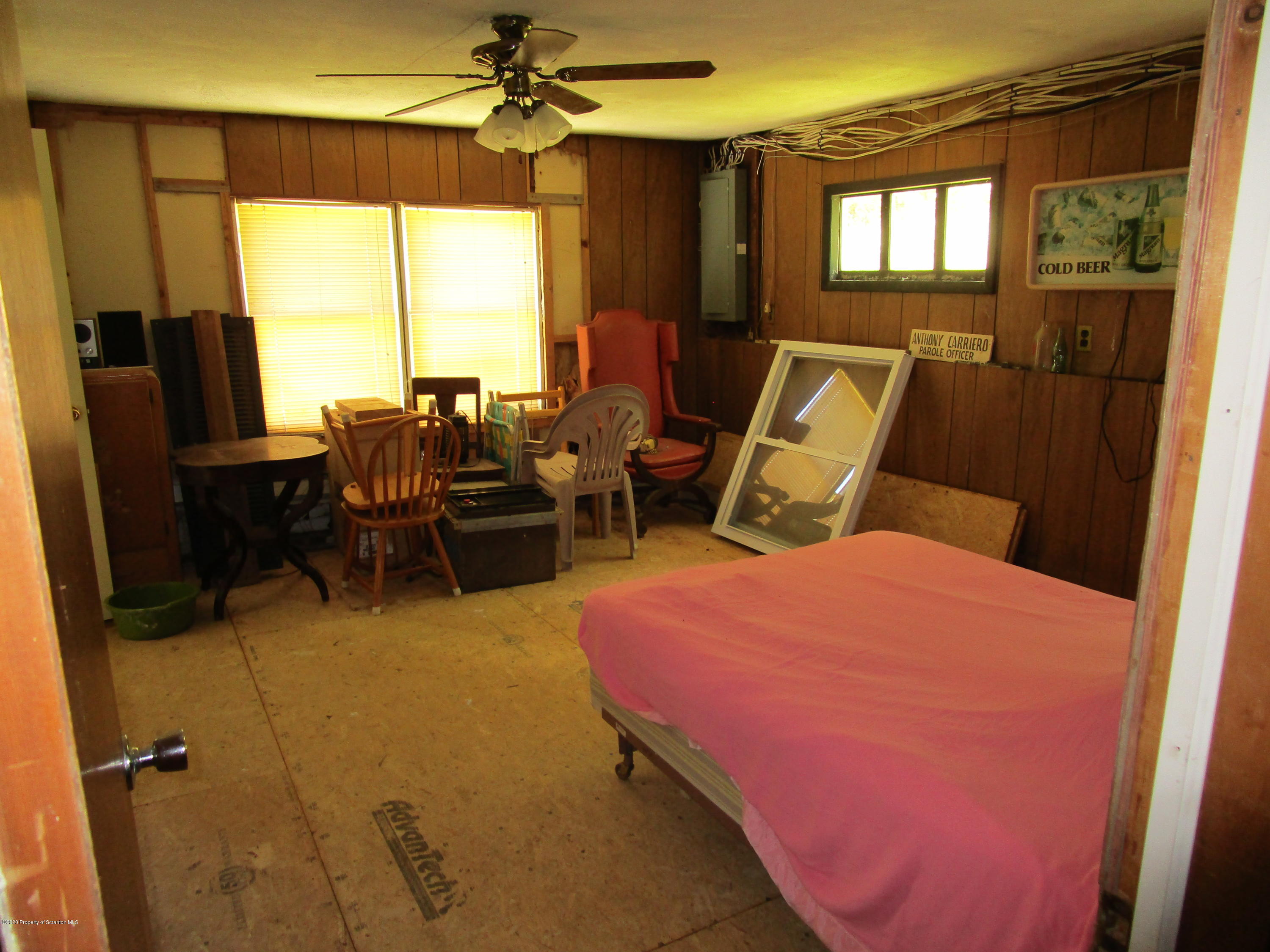 1815 Melrose Road Susquehanna, PA 18847 - Photo 7 of 11 a bedroom with a bed a large window with table and chairs