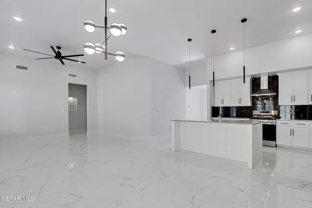 a view of a kitchen with a sink and dishwasher