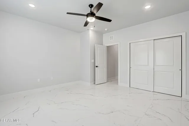 a bathroom with a sink toilet vanity and shower