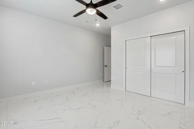 a bathroom with a sink shower and a mirror
