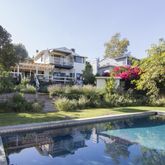 a view of a swimming pool with a yard