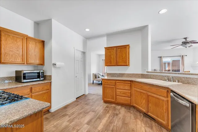 a bedroom with a bed and a ceiling fan