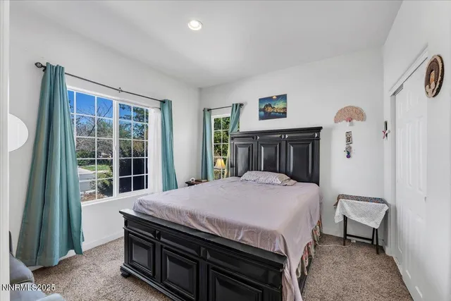 a bathroom with a sink mirror vanity and toilet