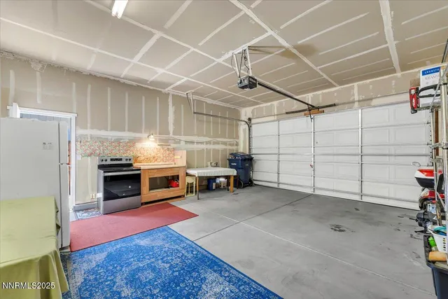 a patio with a table and chairs under an umbrella