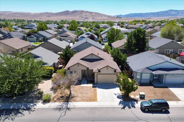 an aerial view of residential houses with outdoor space