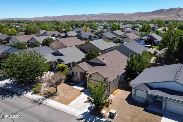 an aerial view of a houses with a outdoor space