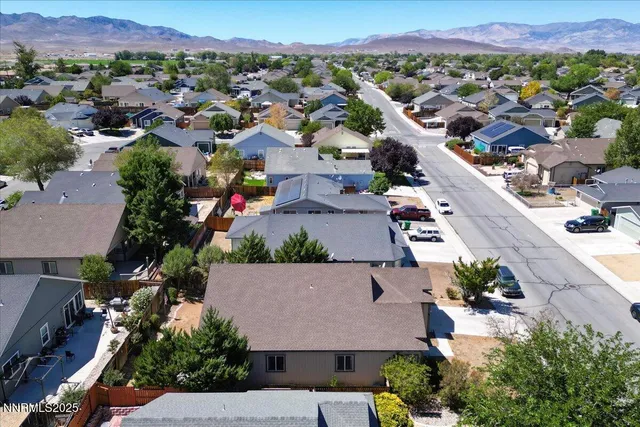 an aerial view of residential houses and outdoor space