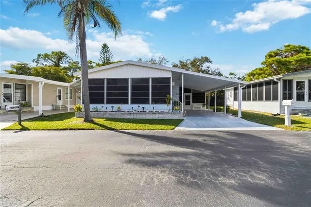 a view of a house with swimming pool and porch