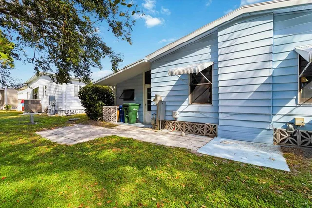 a view of a house with backyard porch and patio