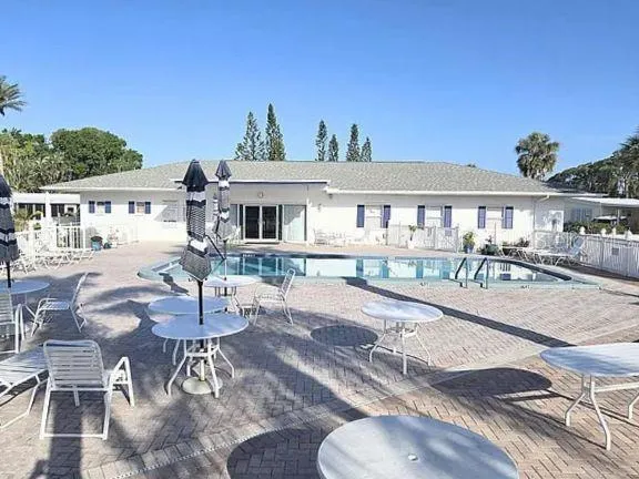 a view of a swimming pool with a terrace