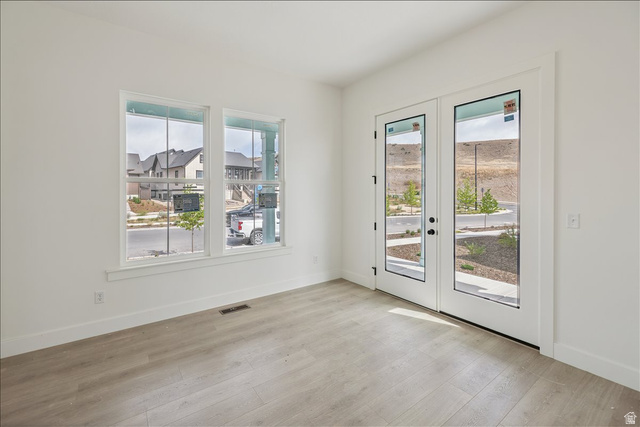 7189 South Sage Road, Unit 214 West Jordan, UT 84081 - Photo 13 of 29 Bright interior space featuring light wood-finish flooring