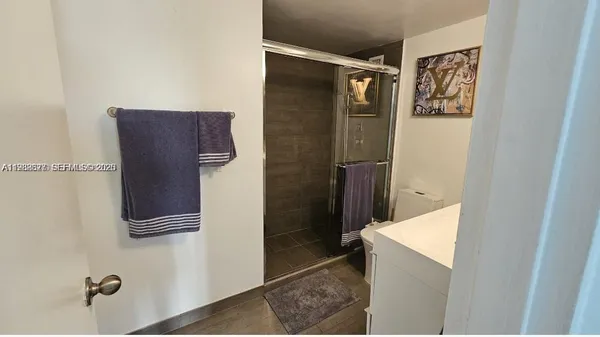 a living room with furniture rug and a table